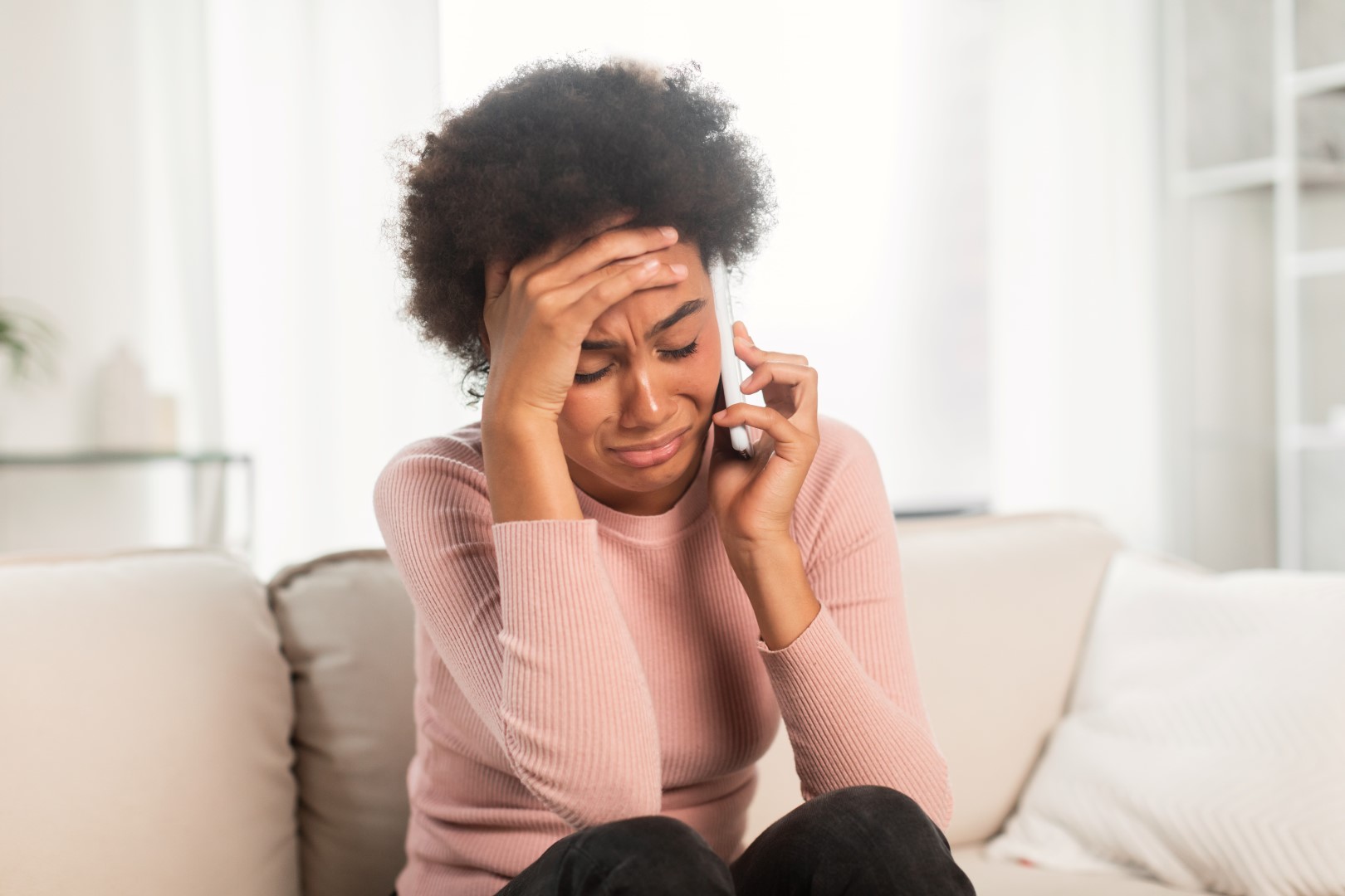 Upset black woman making a phone call